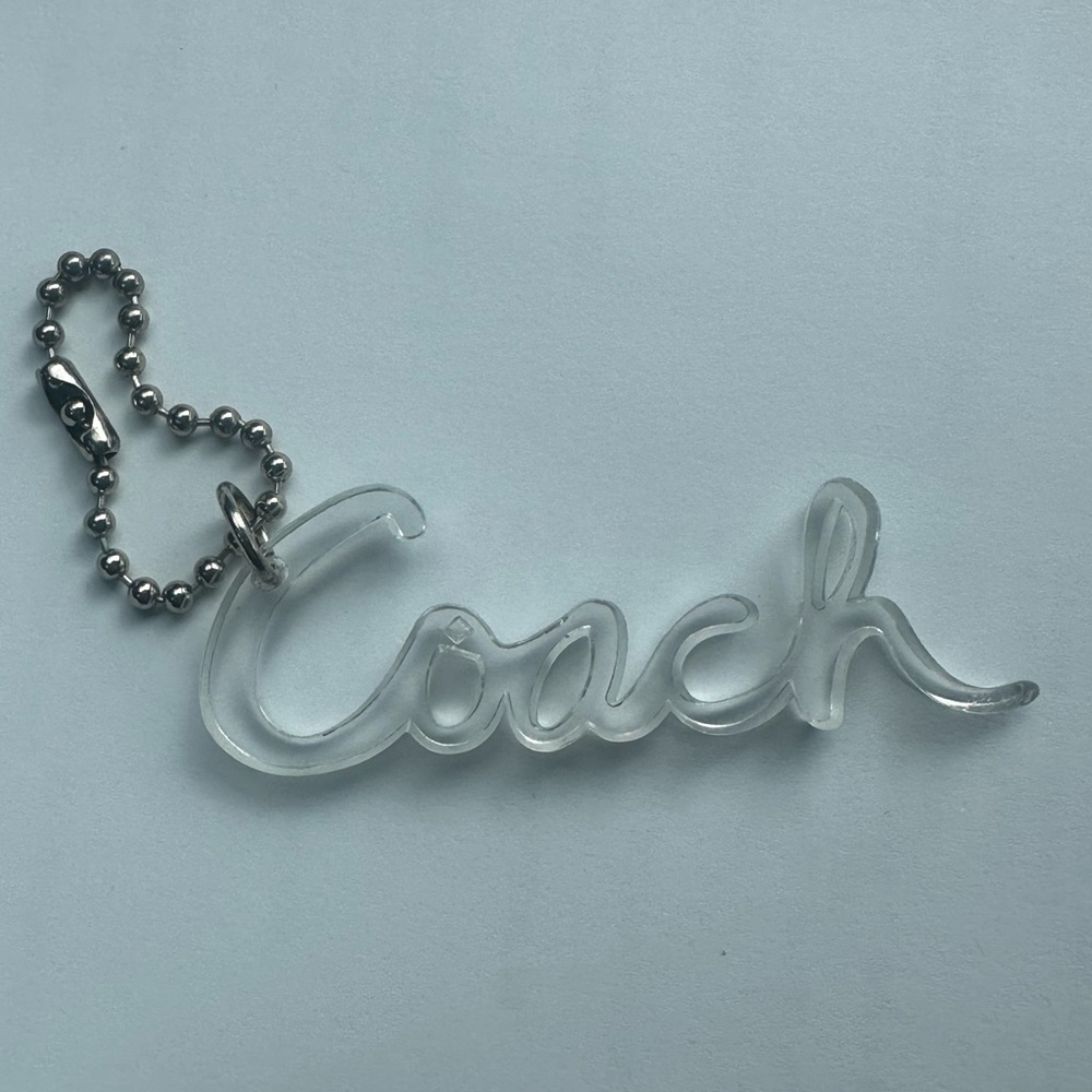 Coach Poppy Clear Script Tag Keychain